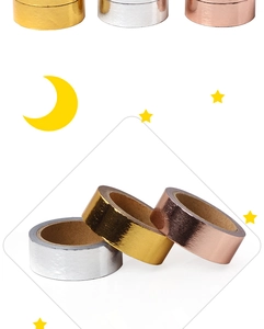 Detail of metallic rose gold, silver, and gold washi tapes with moon and star accents