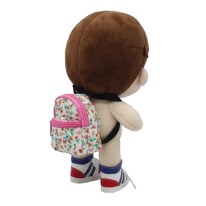 Detailed back view of a floral mini doll backpack with pink zipper on a doll model