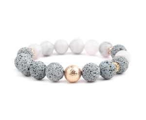 Detail of lava stone beads with white marble beads and gold micro-pave spacers