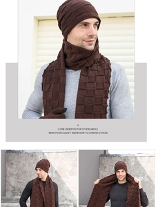 Detailed knit texture of dark brown winter hat and scarf set with checkered patterns