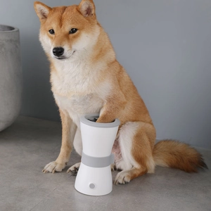 Automatic electric dog paw cleaner with USB charging for pets in white and grey design