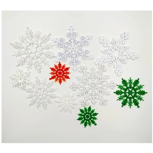 White red and green plastic snowflake ornaments in various sizes for Christmas decor
