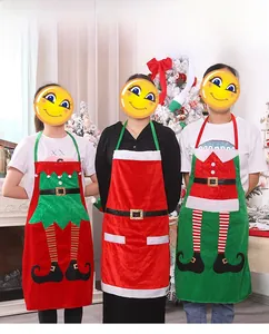 Detailed view of three festive Christmas aprons including Santa and Elf styles for party