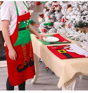 Detailed view of Christmas elf apron and festive placemat with striped leg design