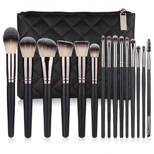 14-piece makeup brush set with black quilted leather case and rose gold wooden handles