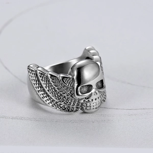 Silver stainless steel skull ring with wing design in 45-degree angle punk style view
