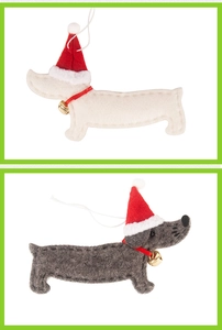 Detail of cute felt dachshund Christmas ornaments with red hats and small golden bells