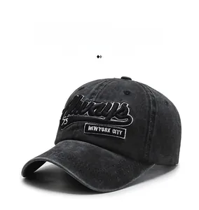 Detail of vintage washed black denim baseball cap with New York City 3D embroidery