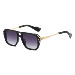 Fashionable oversized aviator sunglasses with black frame, gold metal temples and purple lens