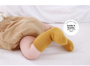 Detailed close-up of yellow ribbed baby socks made of warm fleece-lined premium cotton