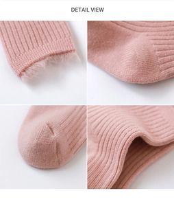 Detail of pink ribbed knit baby socks showing the thick plush lining and soft texture