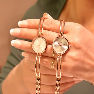Elegant rose gold women's bracelet watch with round dial and quartz movement