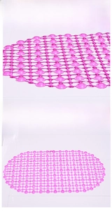 Detail of pink oval PVC bathroom mat with non-slip suction cups and drainage holes
