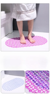 Detail of oval non-slip bathroom mat with suction cups and hollow drainage grid