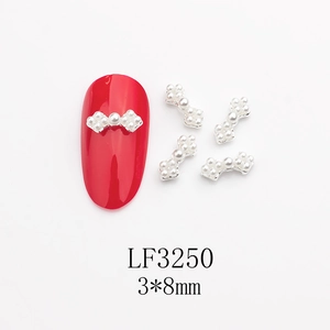 Détail de bijou d'ongle nœud en alliage argenté avec perles de 3x8mm pour manucure DIY