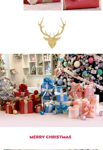 Close-up of stacked colorful Christmas gift boxes with satin ribbons and tree backdrop