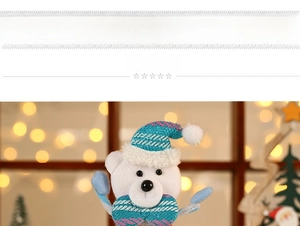 Close-up of a cute plush Christmas bear wearing a blue sequined hat and matching bowtie