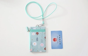 Detail of light blue floral PU leather card holder with lanyard and side zipper pocket