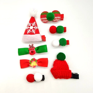 7-piece Christmas hair clip set featuring Santa hats, reindeer bows and plush pom-poms