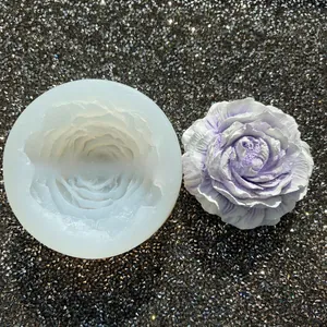 Detailed macro view of 3D peony flower silicone mold with finished purple resin craft flower