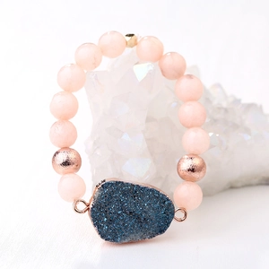 Pink stone beaded bracelet with a blue druzy cluster pendant and rose gold accents