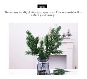 Realistic artificial green pine needles in a gray glass vase for Christmas home decor