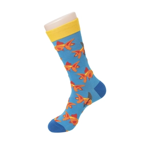 Detail of crew socks in teal blue featuring orange goldfish patterns and yellow ribbed cuffs