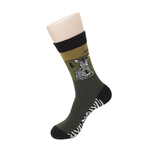 Close-up of knit crew socks in dark green with black trim and zebra pattern detail