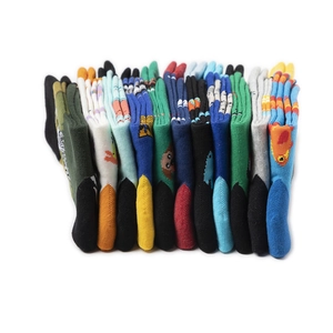 Detailed view of stacked cotton mid-calf socks with various colorful cartoon animal patterns