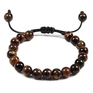 Detail of yellow tiger eye beaded bracelet with adjustable black braided rope and beads
