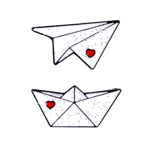 Cute glitter paper airplane and boat enamel pins with red heart details on white background