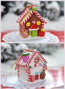 Detailed close-up of decorative Christmas gingerbread house with candy cane and sugar accents