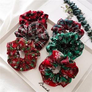 6-pack Christmas scrunchies in red, green, and plaid fabric with white snowflake patterns