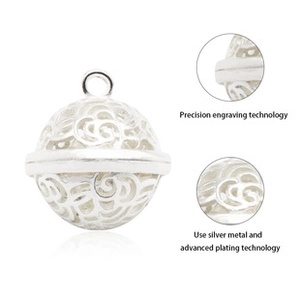 Detailed macro view of the precision hollow engraving on a silver pearl pendant charm