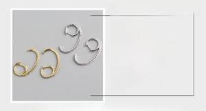 Detail view of S925 sterling silver hoop earrings with dimensions 25mm and zircon stones