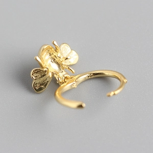Polished gold S925 sterling silver hoop earrings with 3D bee pendant on grey background