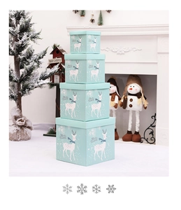 Detailed stack of light blue Christmas gift boxes with reindeer and snowflake patterns