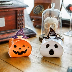 Halloween gift boxes featuring pumpkin and ghost designs with wizard hat handles