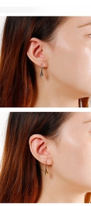 Polished stainless steel teardrop earrings in gold and silver finish shown on a model