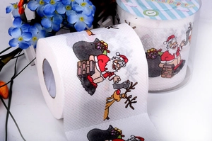 Detail of Christmas toilet paper roll with Santa Claus print and cylindrical packaging