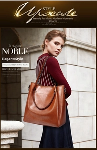 Detail of vintage oiled leather texture on large capacity brown bucket shoulder bag