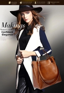 Detail view of large vintage brown oil-wax leather bucket bag on model shoulder
