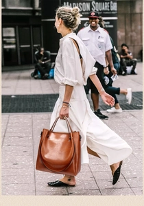 Brown vintage leather bucket bag with large capacity for daily commuting in the city