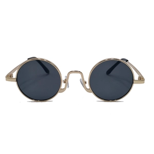 Macro detail of retro round metal frame and dark lens of these vintage sunglasses
