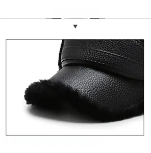 Close-up of winter baseball cap with lychee pattern PU leather and faux fur lining detail