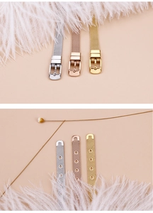 Detailed view of silver, gold, and rose gold mesh bracelets with adjustable buckle