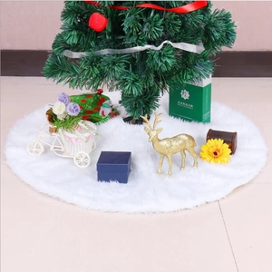 Close-up of fluffy white faux fur Christmas tree skirt with plush holiday decorations
