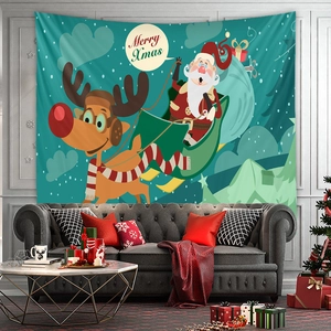 Detail of Christmas wall tapestry with Santa and reindeer above a cozy sofa setup