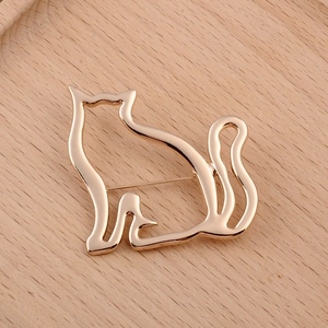 Cute golden hollow cat brooch pin for women in a minimalist Japanese style design