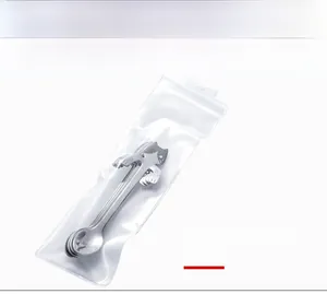 Detailed view of the 304 stainless steel cat-shaped spoons in clear PVC packaging
